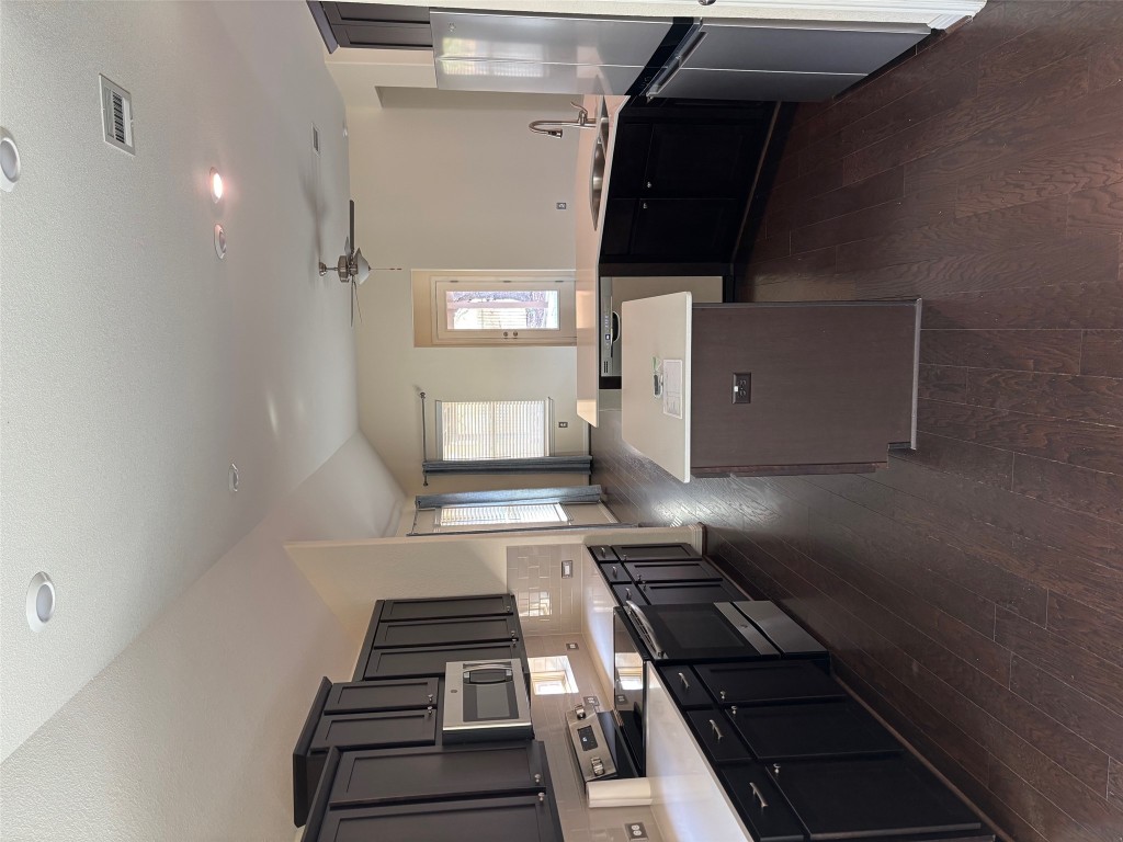 1421 Morning View Road Georgetown, TX 78628 - Photo 15 of 39 a large kitchen with a large counter top appliances and cabinets