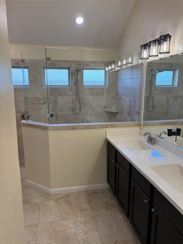 a kitchen with a sink and cabinets