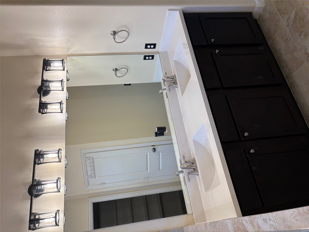 1421 Morning View Road Georgetown, TX 78628 - Photo 19 of 39 a bathroom with a double vanity sink and a mirror