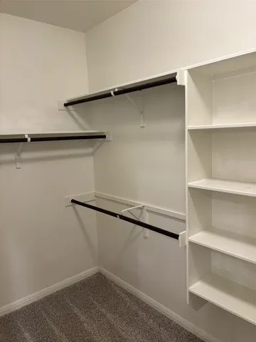 a view of an empty walk in closet