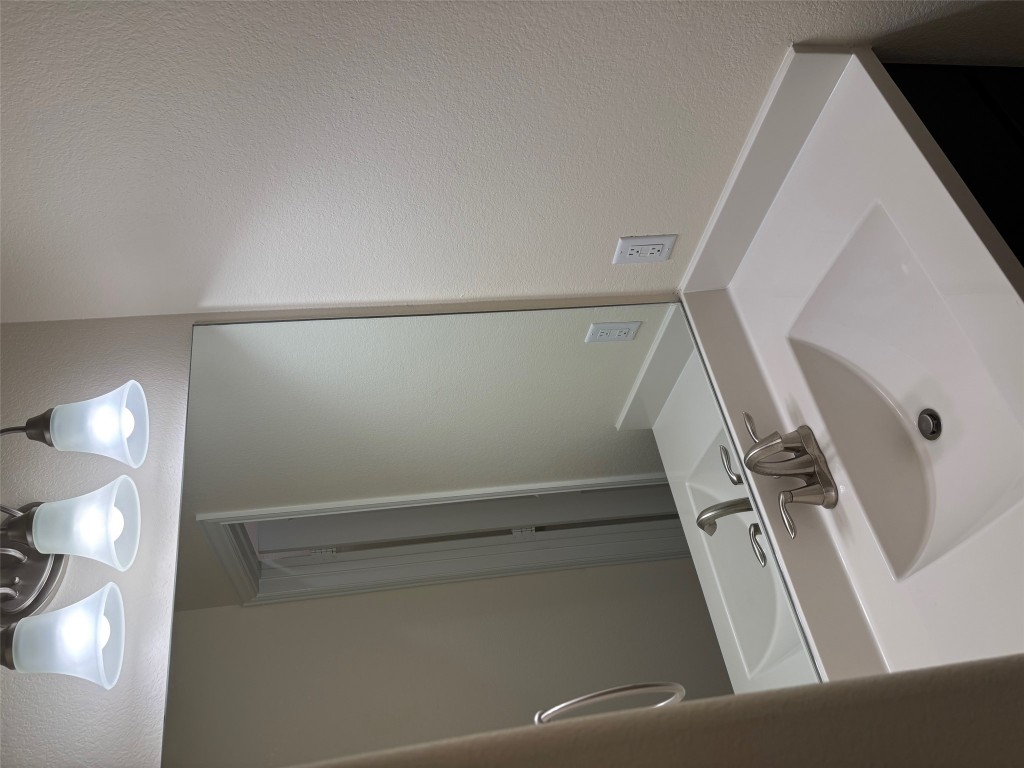 1421 Morning View Road Georgetown, TX 78628 - Photo 24 of 39 a bathroom with a sink and a large mirror