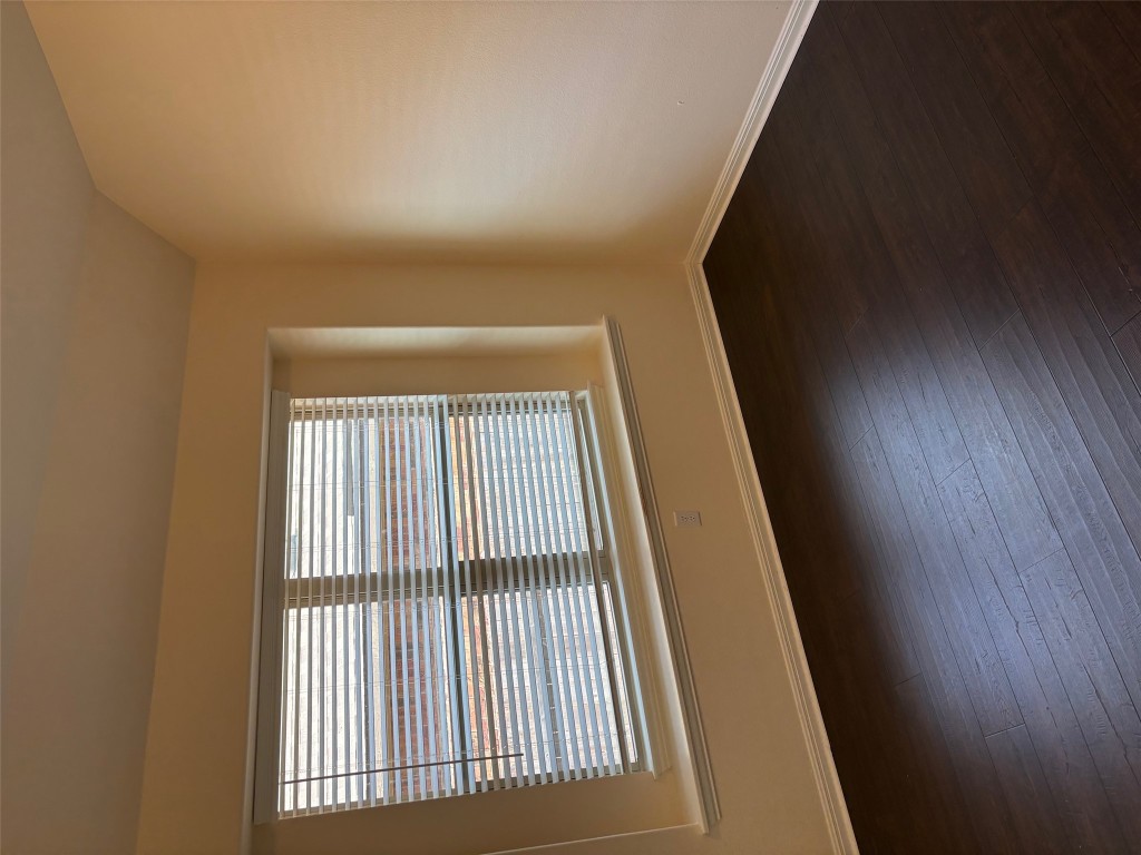 1421 Morning View Road Georgetown, TX 78628 - Photo 29 of 39 a view of an empty room with wooden floor and a window