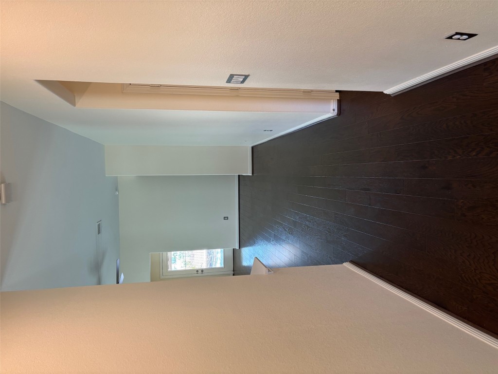 1421 Morning View Road Georgetown, TX 78628 - Photo 9 of 39 an empty room with wooden floor and windows