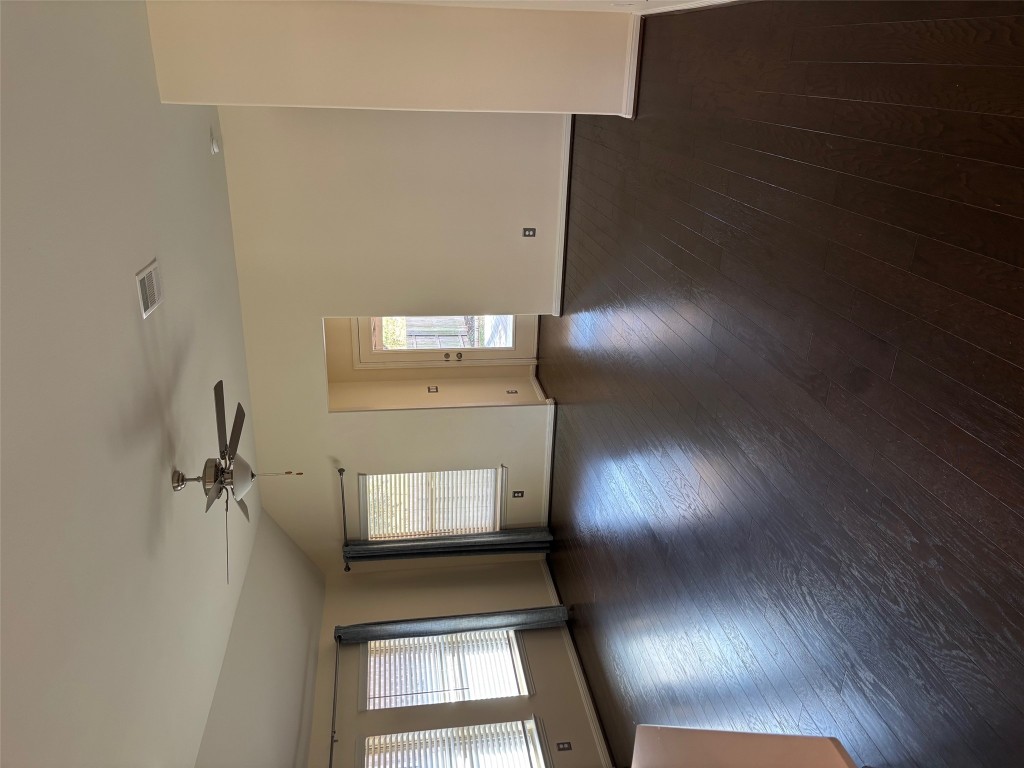 1421 Morning View Road Georgetown, TX 78628 - Photo 10 of 39 an empty room with wooden floor and windows
