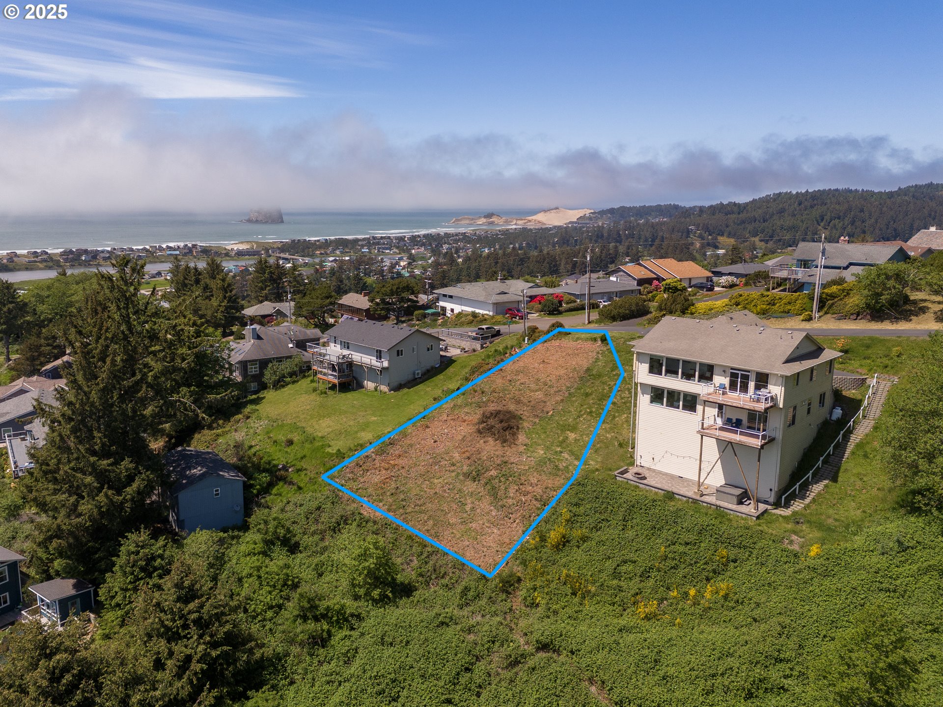 14901 East Summit Road Pacific City, OR 97135 - Photo 4 of 6 an aerial view of a house with a garden and lake view