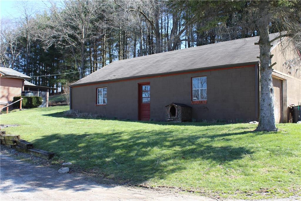 356 Willow Road Avella, PA 15312 - Photo 17 of 25 All block building can be utilized as detached garage, workshop, man cave, extra storage - lots of possibilities!