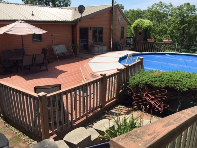 356 Willow Road Avella, PA 15312 - Photo 20 of 25 Trex Deck has doors leading to it and the pool from the Kitchen and Great Room