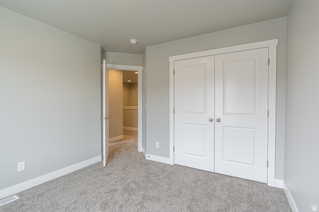 2257 South 1090 West, Unit 74 Nibley, UT 84321 - Photo 12 of 40 Neutral-toned carpeting throughout the room