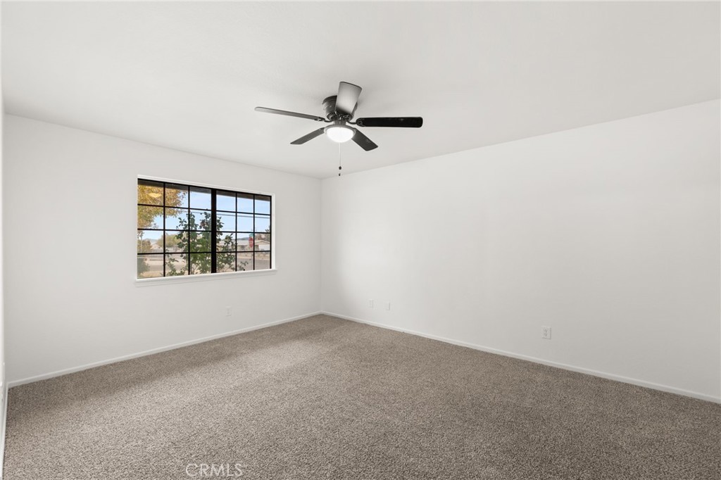 17805 Walnut Street Hesperia, CA 92345 - Photo 14 of 18 wooden floor in an empty room with a window