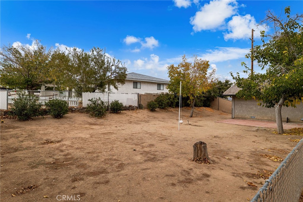 17805 Walnut Street Hesperia, CA 92345 - Photo 18 of 18 a backyard of a house with table and chairs