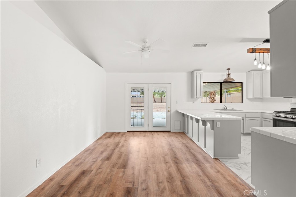 17805 Walnut Street Hesperia, CA 92345 - Photo 8 of 18 wooden floor in an empty room with a window