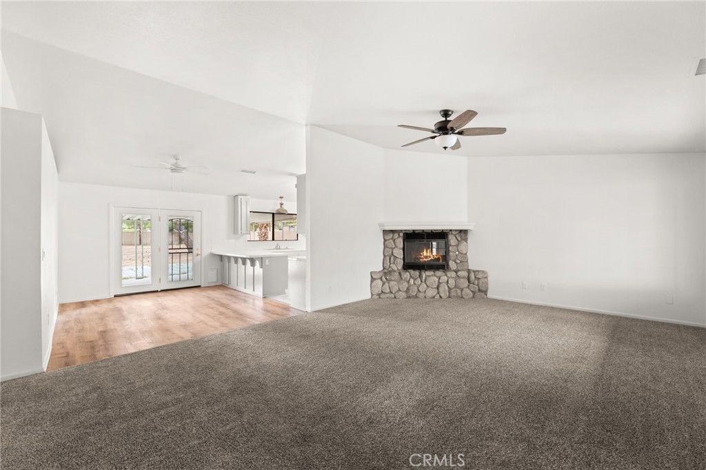 17805 Walnut Street Hesperia, CA 92345 - Photo 9 of 18 an empty room with windows and ceiling fan