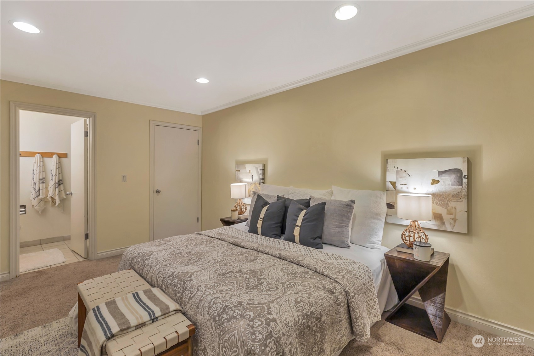 5021 Ripley Lane North, Unit 306 Renton, WA 98056 - Photo 8 of 22 a bedroom with a bed and wooden floor