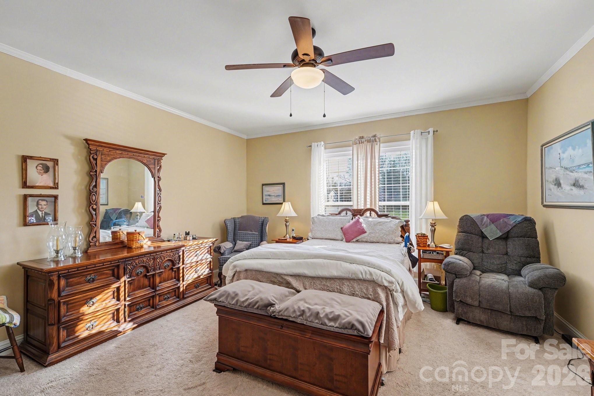 212 Pine Valley Road Mocksville, NC 27028 - Photo 14 of 28 a bedroom with bed couch and window