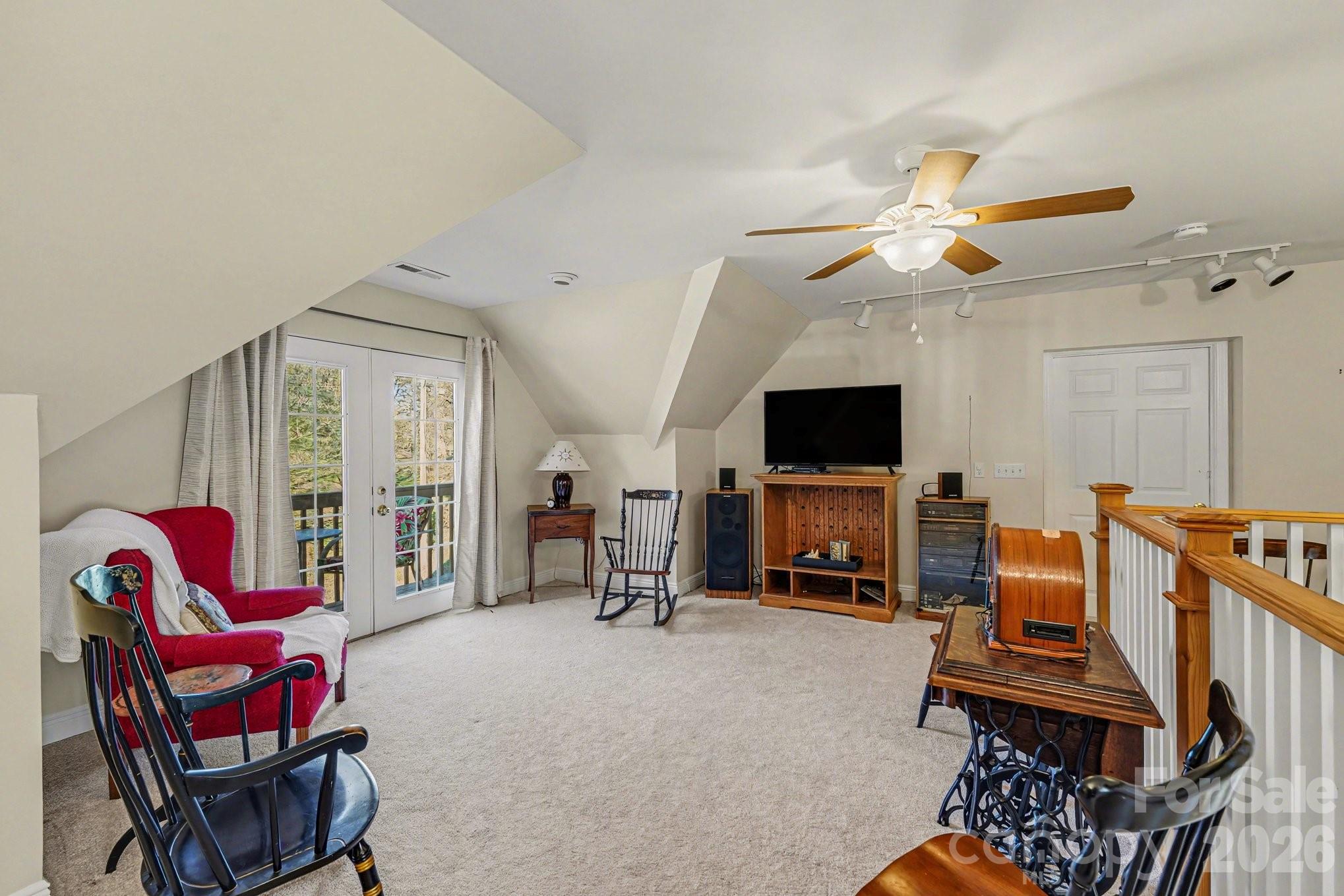 212 Pine Valley Road Mocksville, NC 27028 - Photo 19 of 28 a living room with furniture a flat screen tv and a fireplace