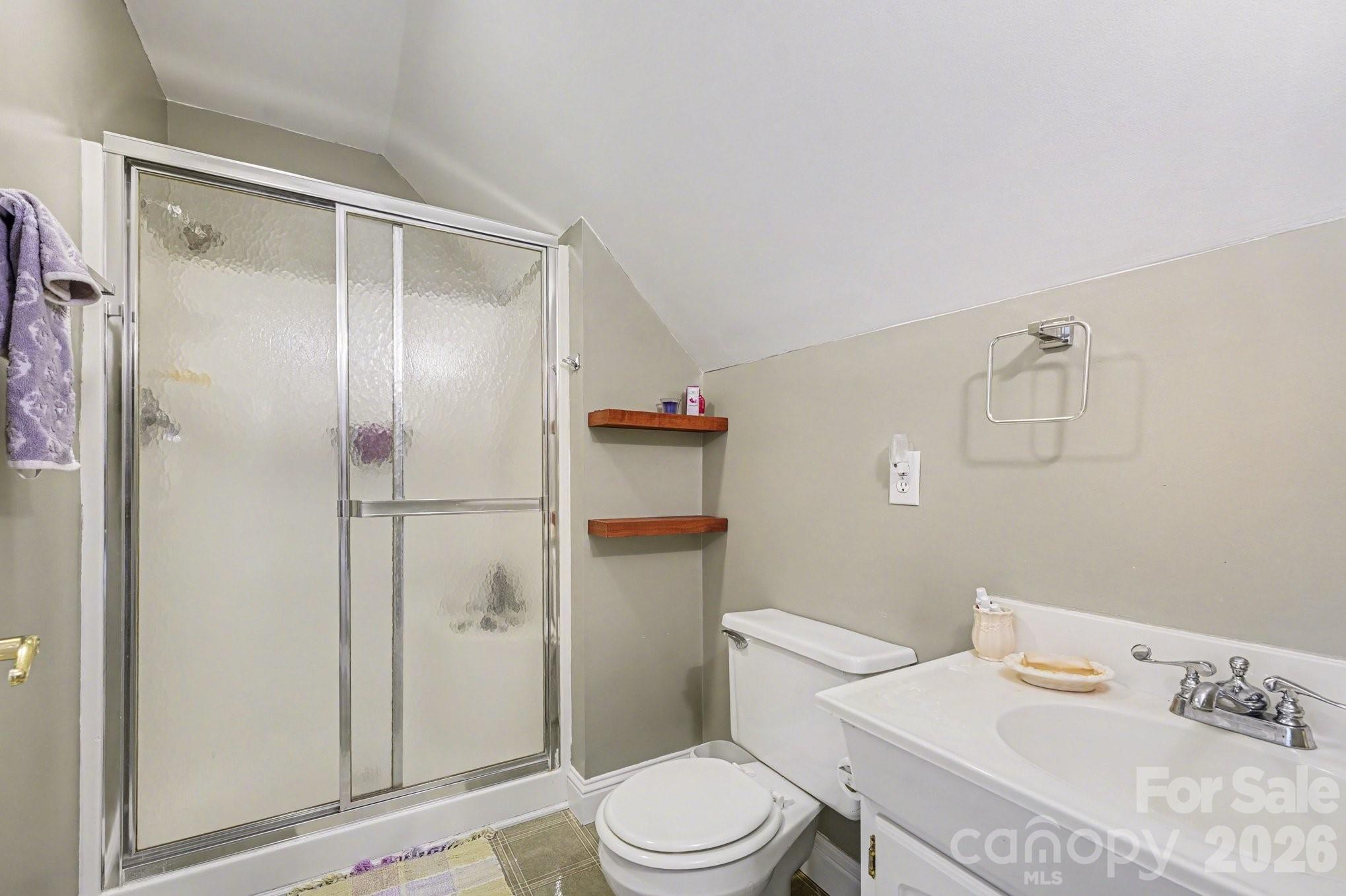 212 Pine Valley Road Mocksville, NC 27028 - Photo 24 of 28 a white toilet sitting next to a bathroom sink