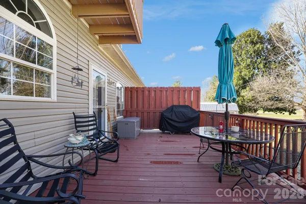 a view of a chairs and table in the patio