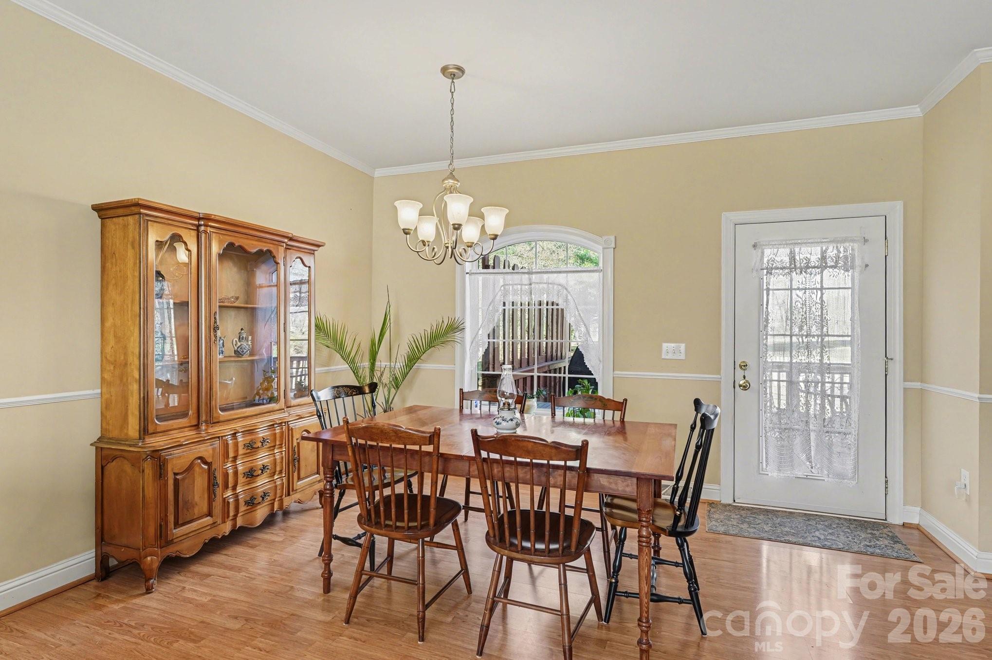 212 Pine Valley Road Mocksville, NC 27028 - Photo 8 of 28 a view of a dining room with furniture window and wooden floor