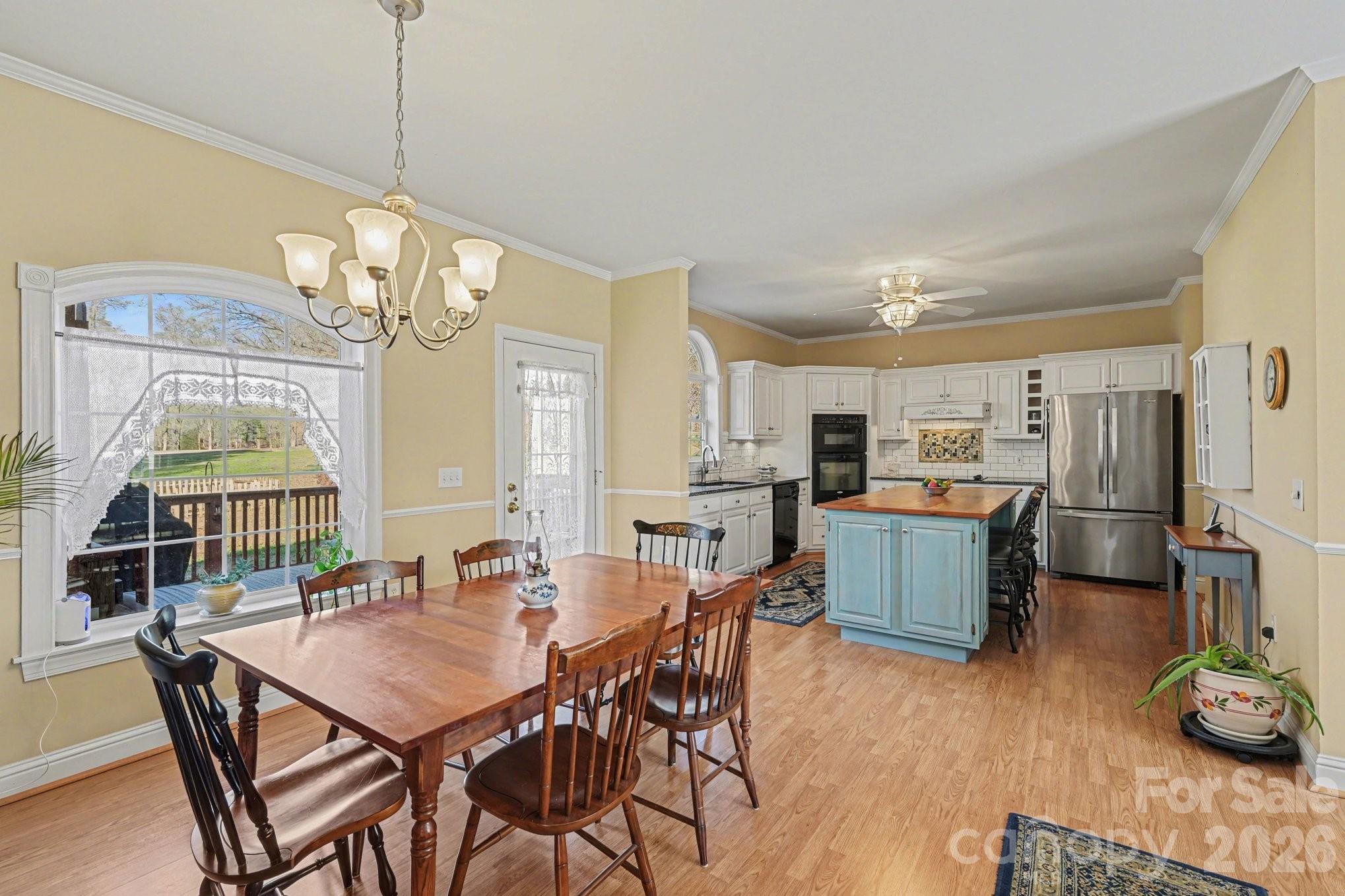 212 Pine Valley Road Mocksville, NC 27028 - Photo 9 of 28 a view of a dining room with furniture window and wooden floor