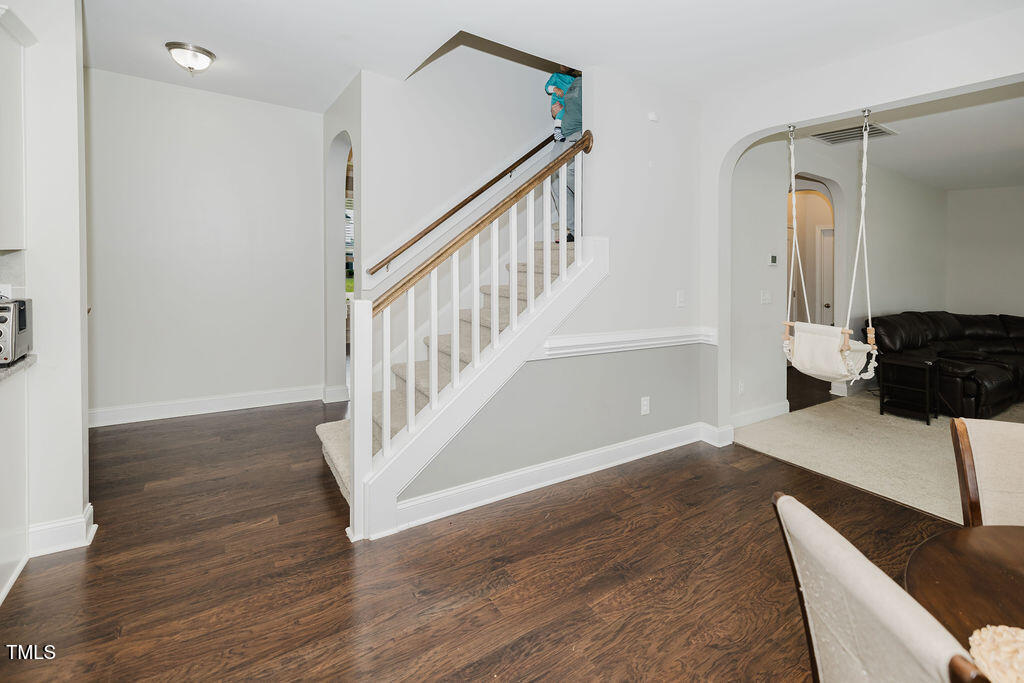 105 Perignon Drive Princeton, NC 27569 - Photo 13 of 38 a view of entryway with wooden floor and stairs
