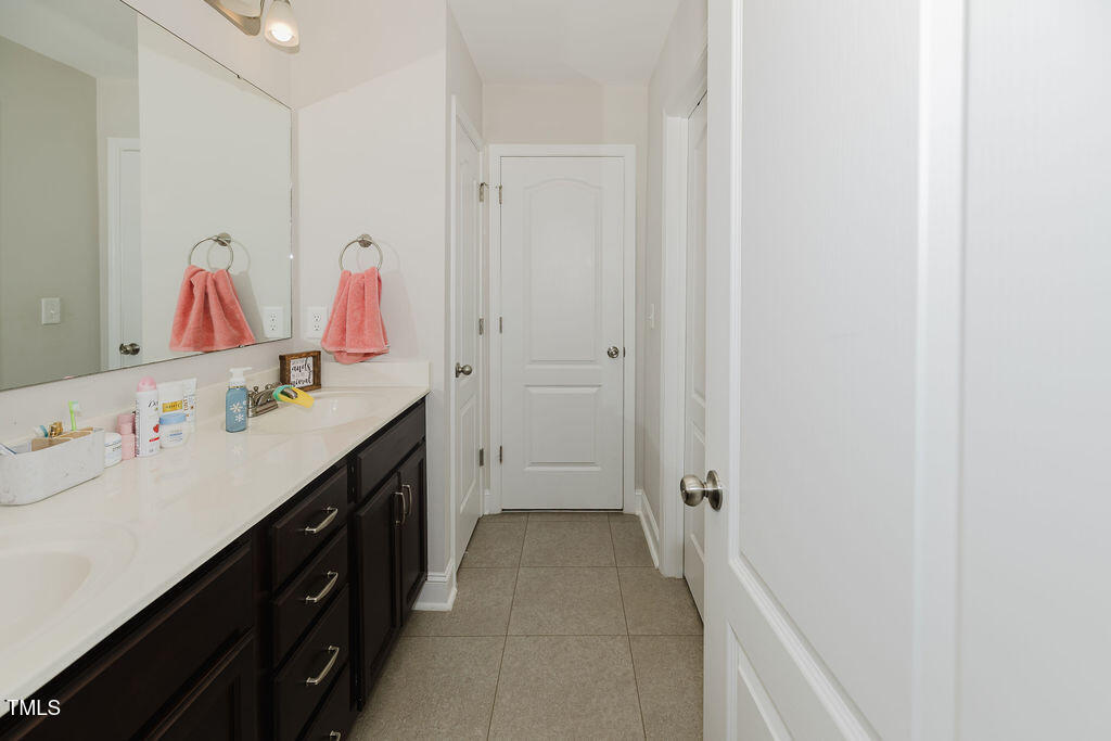 105 Perignon Drive Princeton, NC 27569 - Photo 16 of 38 a bathroom with a tub sink and mirror