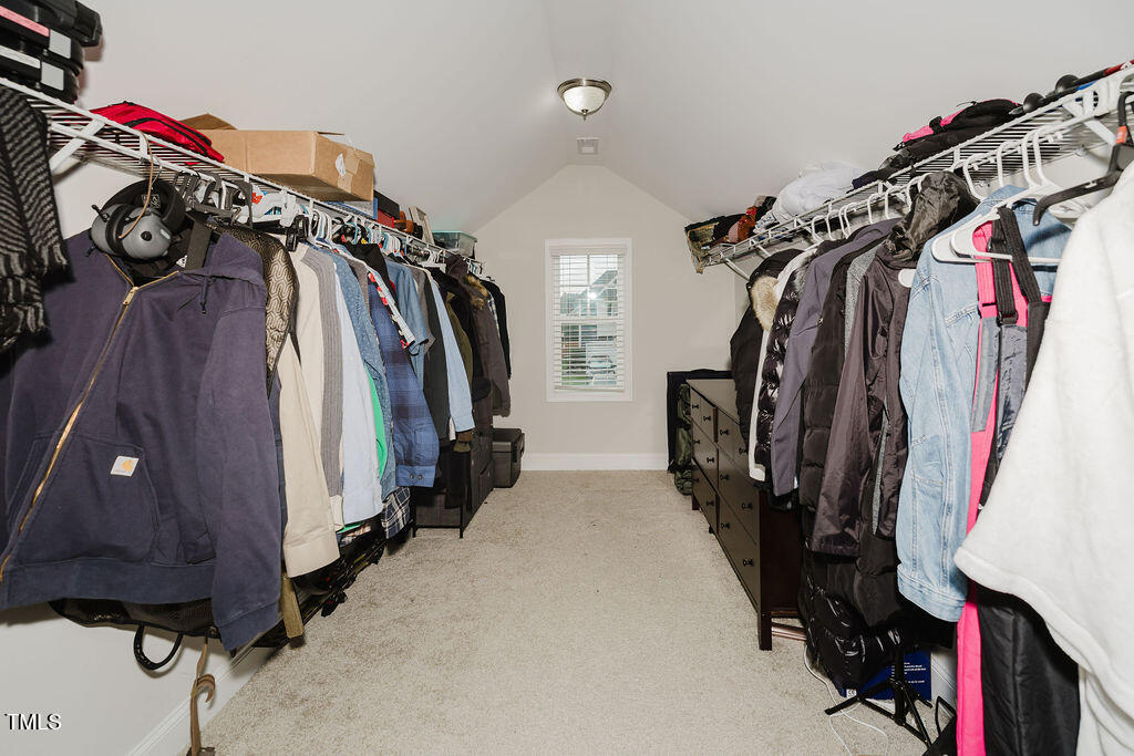 105 Perignon Drive Princeton, NC 27569 - Photo 27 of 38 a view of walk in closet with clothes and shoes