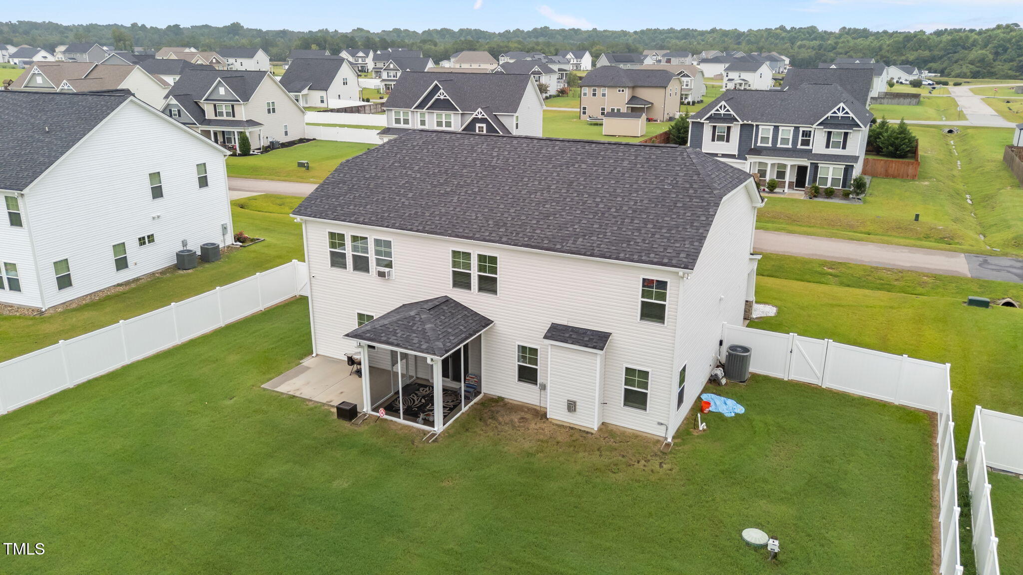 105 Perignon Drive Princeton, NC 27569 - Photo 34 of 38 an aerial view of a house with a garden and lake view