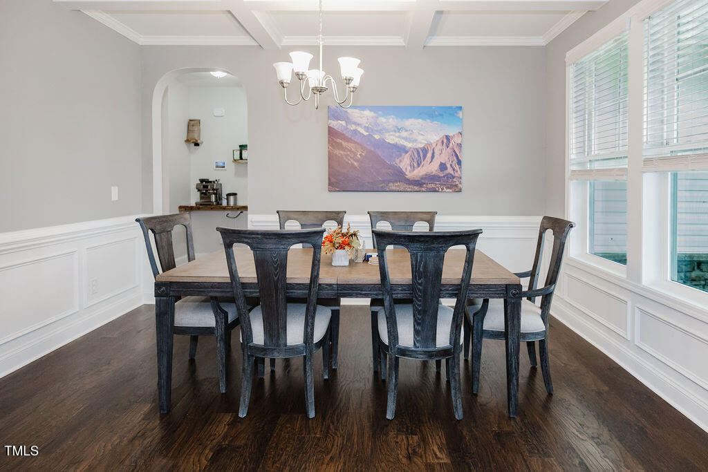 105 Perignon Drive Princeton, NC 27569 - Photo 3 of 38 a view of a dining room with furniture wooden floor and a chandelier