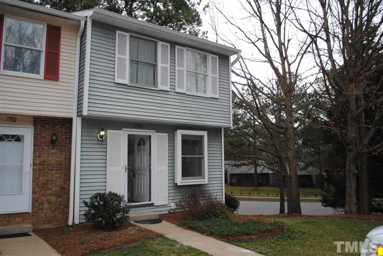 7700 Ohmann Court Raleigh, NC 27615 - Photo 1 of 20 a front view of a house with garden