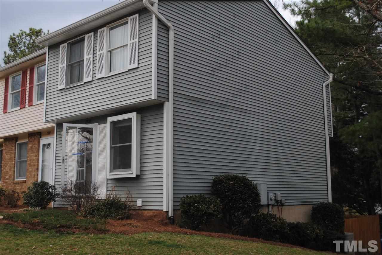 7700 Ohmann Court Raleigh, NC 27615 - Photo 2 of 20 a front view of a house with plants