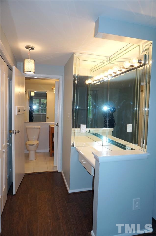7700 Ohmann Court Raleigh, NC 27615 - Photo 11 of 20 a view of a bathroom with a tub and shower