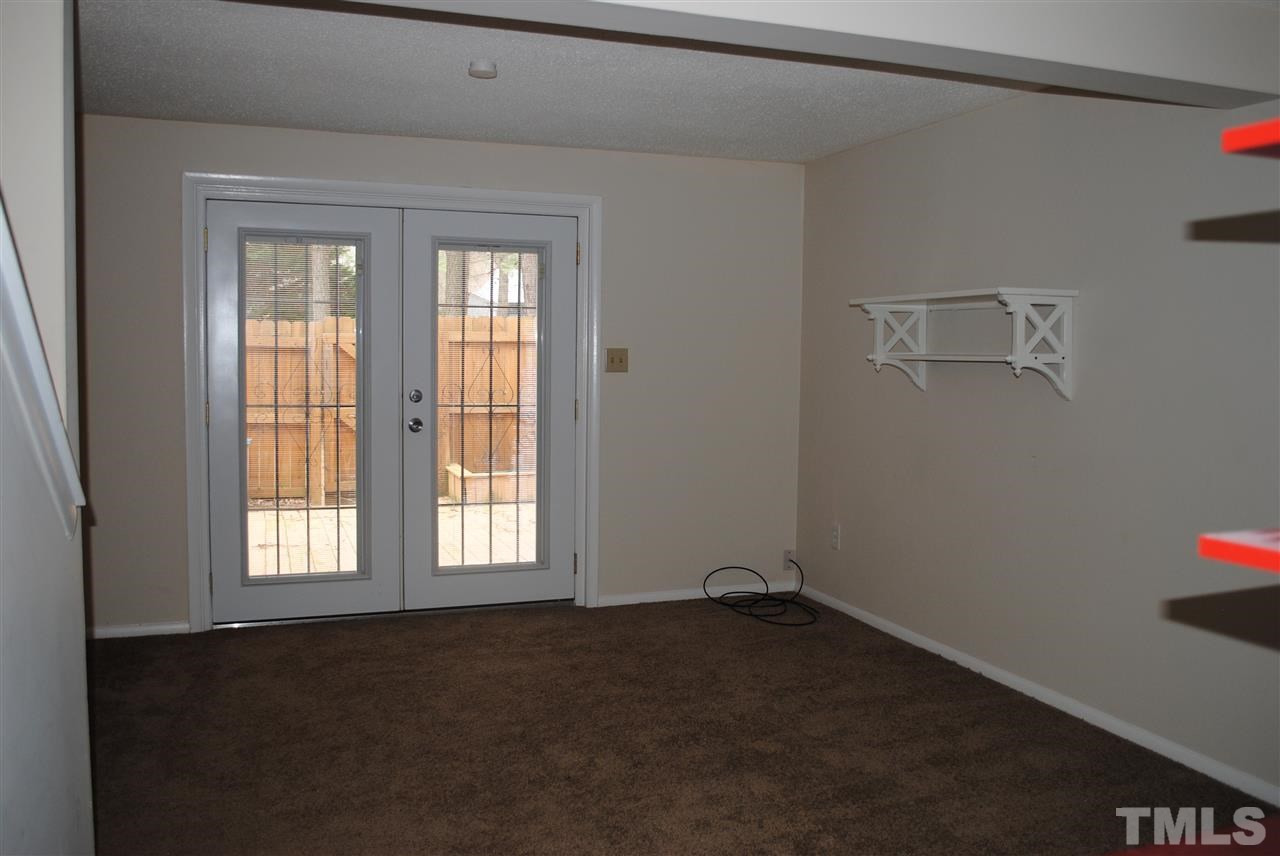 7700 Ohmann Court Raleigh, NC 27615 - Photo 14 of 20 a room that has a window in it