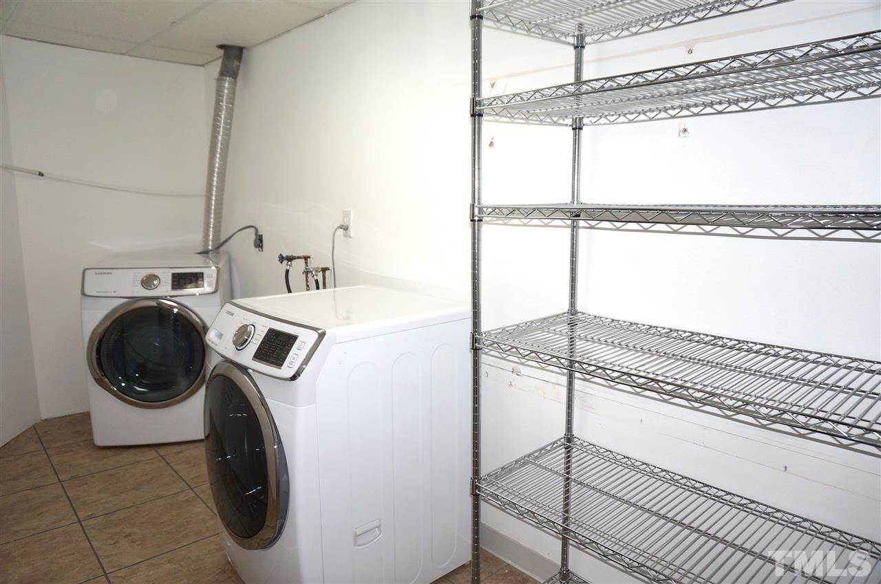 7700 Ohmann Court Raleigh, NC 27615 - Photo 16 of 20 a utility room with dryer and washer