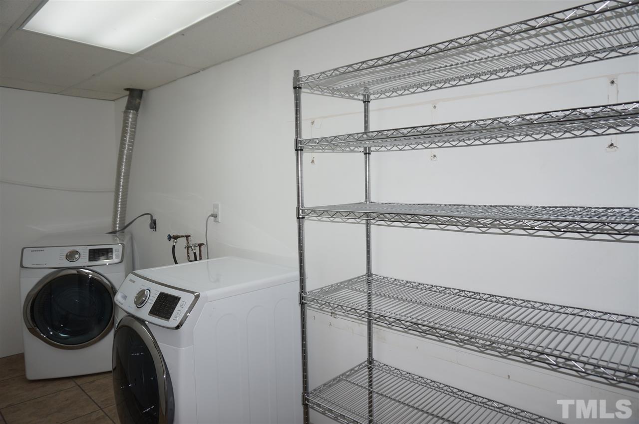 7700 Ohmann Court Raleigh, NC 27615 - Photo 19 of 20 a utility room with dryer and washer