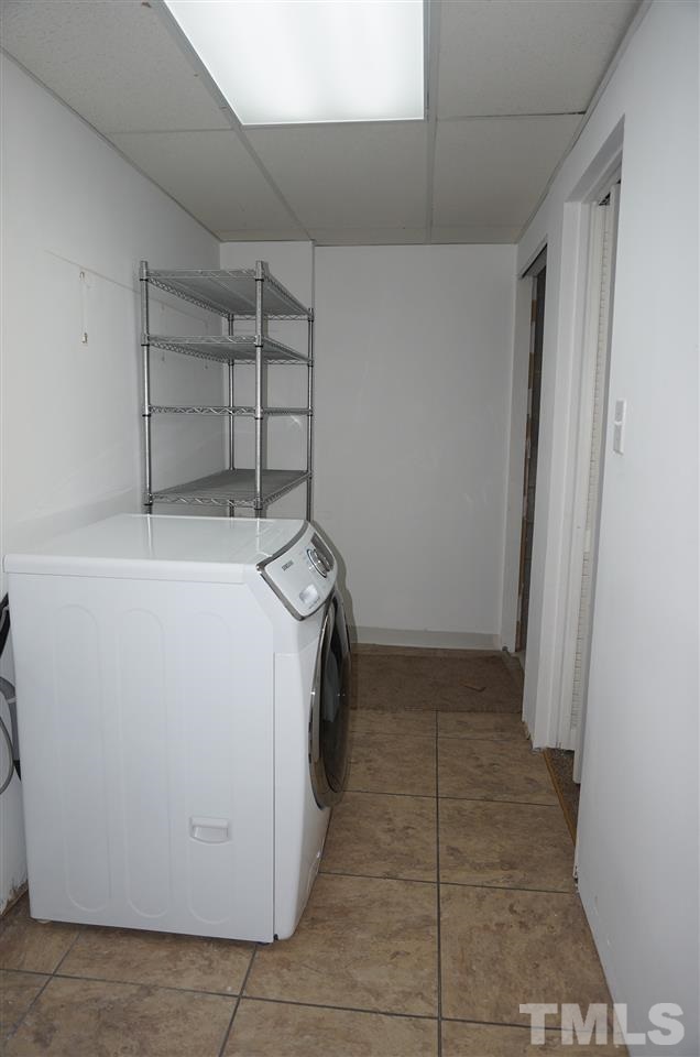 7700 Ohmann Court Raleigh, NC 27615 - Photo 20 of 20 a utility room with dryer and washer