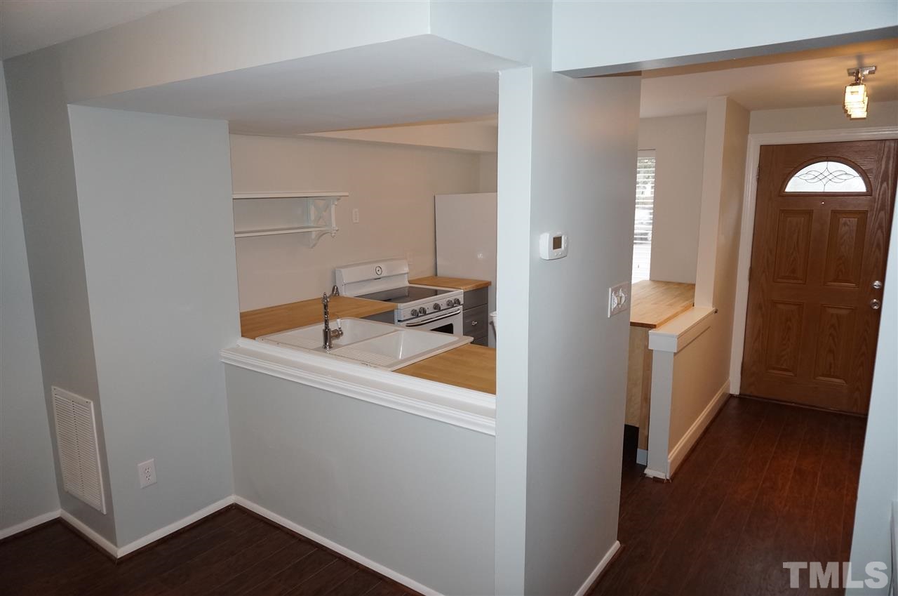7700 Ohmann Court Raleigh, NC 27615 - Photo 6 of 20 a bathroom with a sink and a mirror
