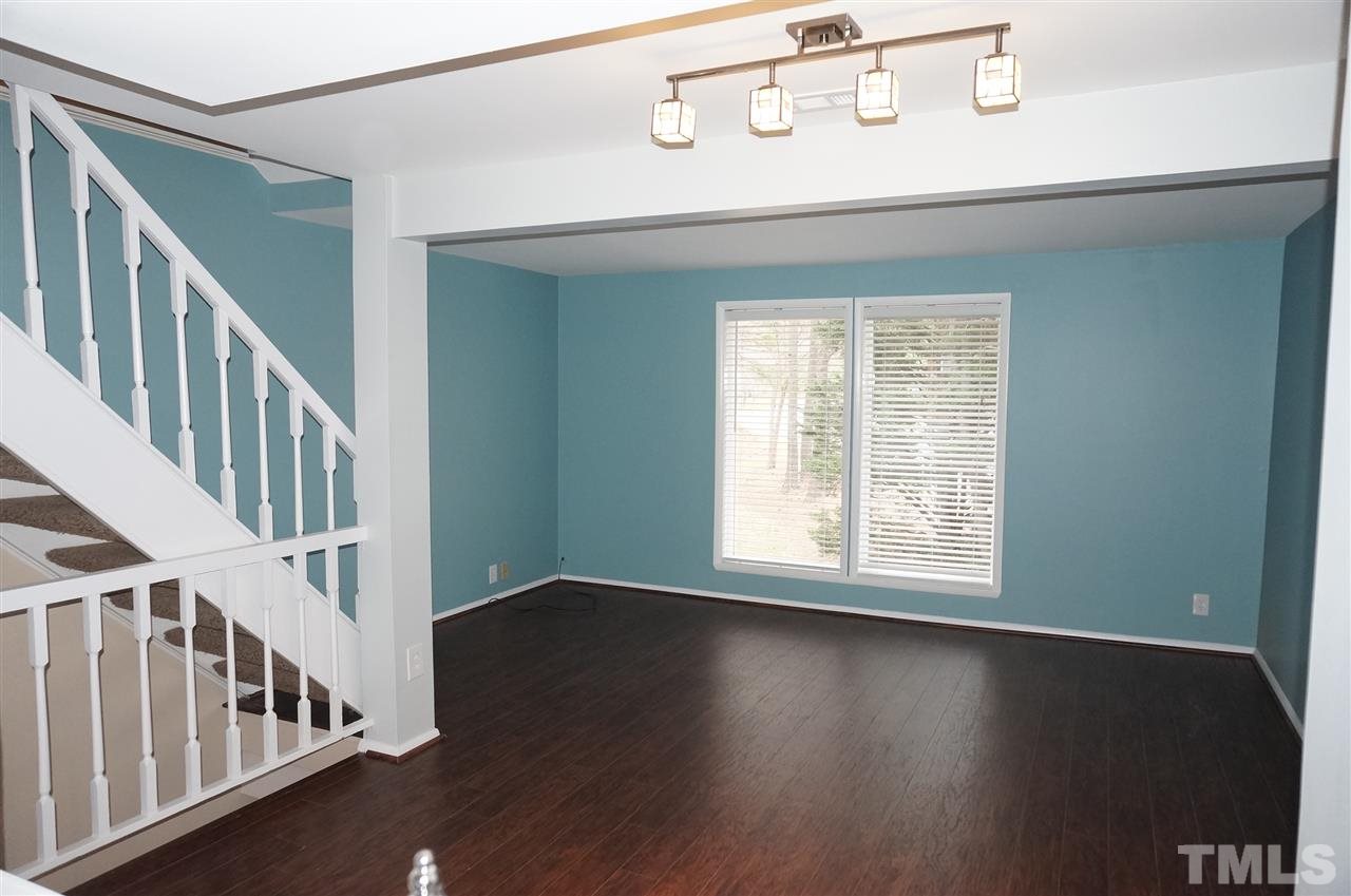 7700 Ohmann Court Raleigh, NC 27615 - Photo 7 of 20 a view of an entryway with wooden floor