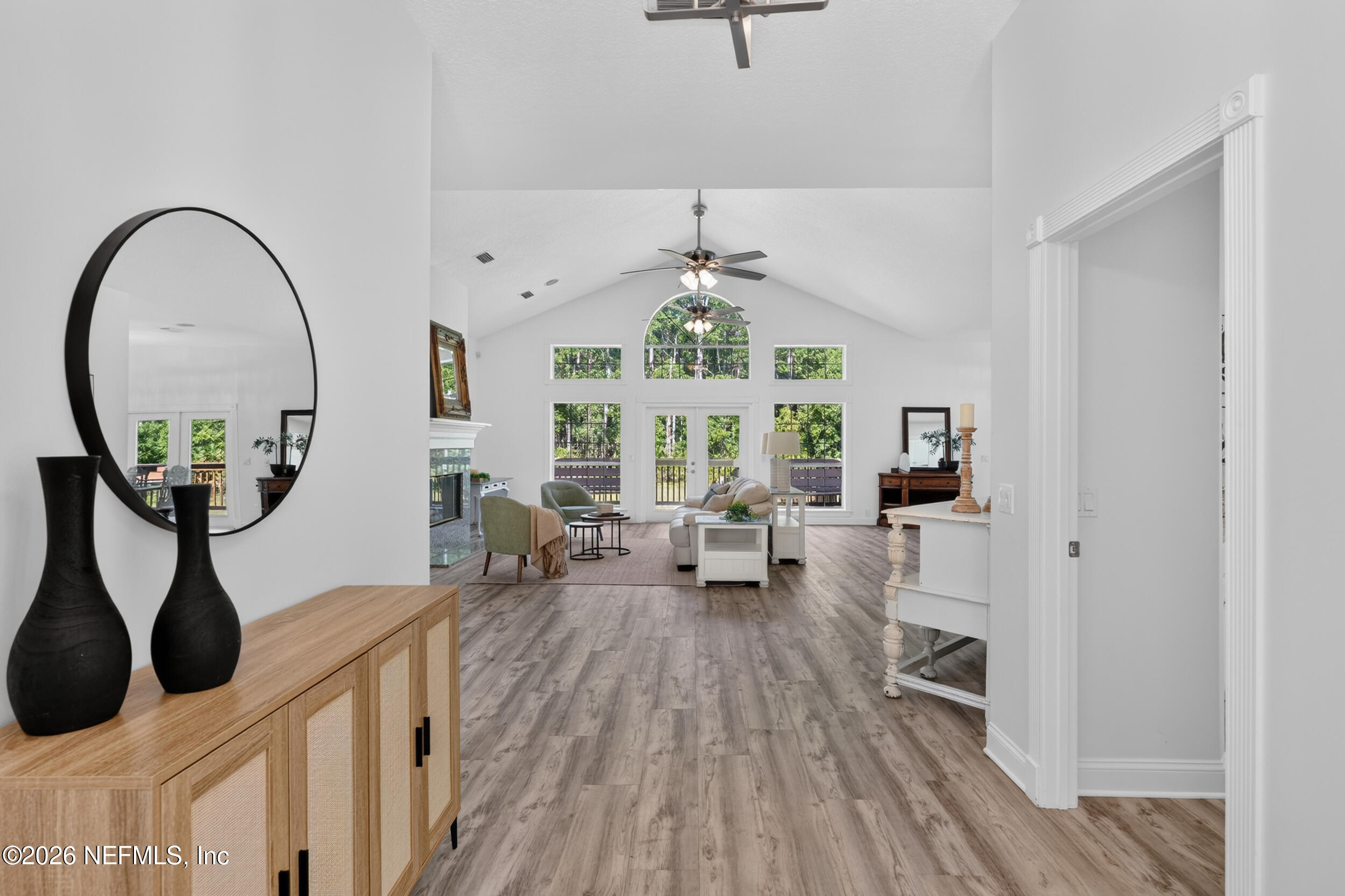 3090 Monument Bay Road St. Augustine, FL 32092 - Photo 5 of 56 a living room with furniture a window and wooden floor