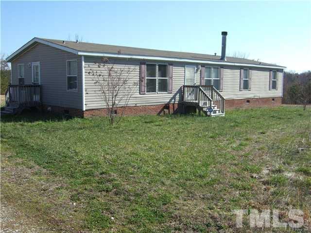 205 Cousin Road Rougemont, NC 27572 - Photo 1 of 8 a front view of a house with garden