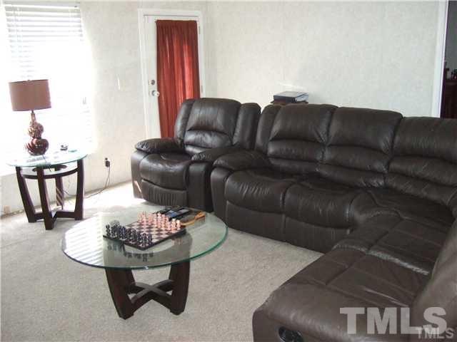 205 Cousin Road Rougemont, NC 27572 - Photo 5 of 8 a living room with furniture and a wooden floor