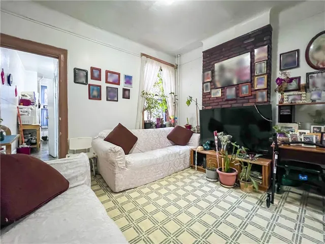 a living room with furniture fireplace and flat screen tv
