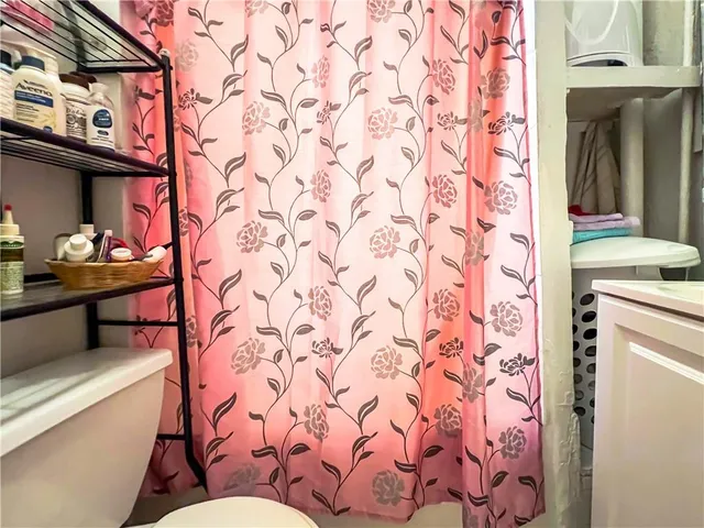 a bedroom with a bed and a closet