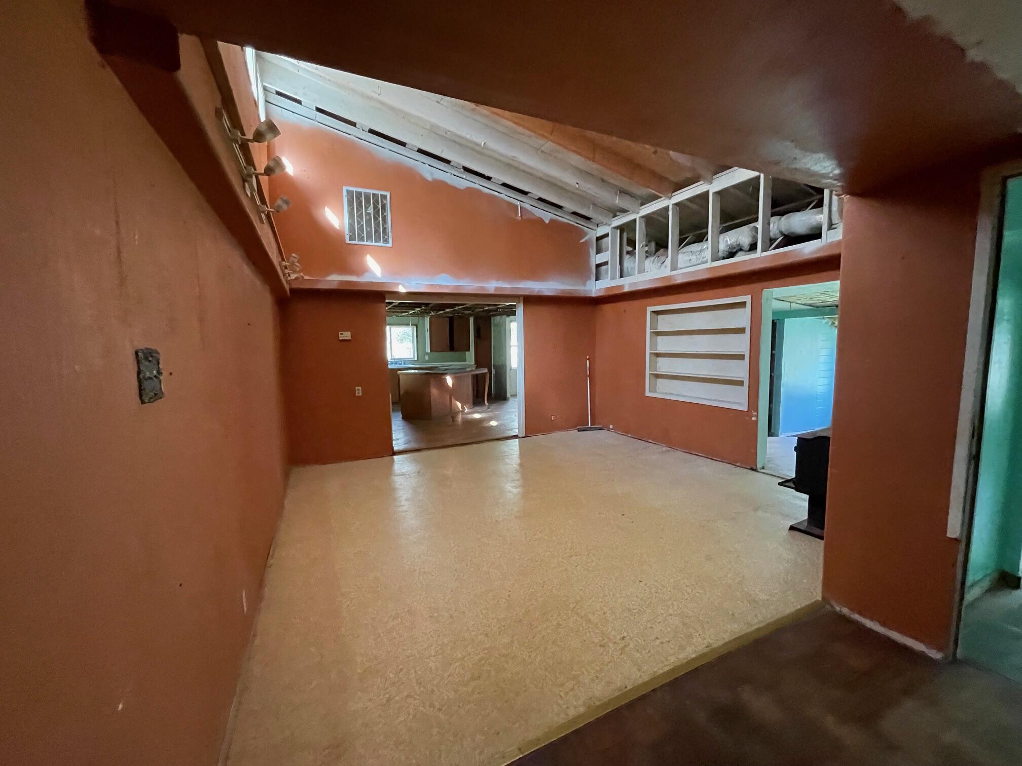 411 South Old Stage Road Cave Junction, OR 97523 - Photo 4 of 39 a view of a room with wooden floor and windows