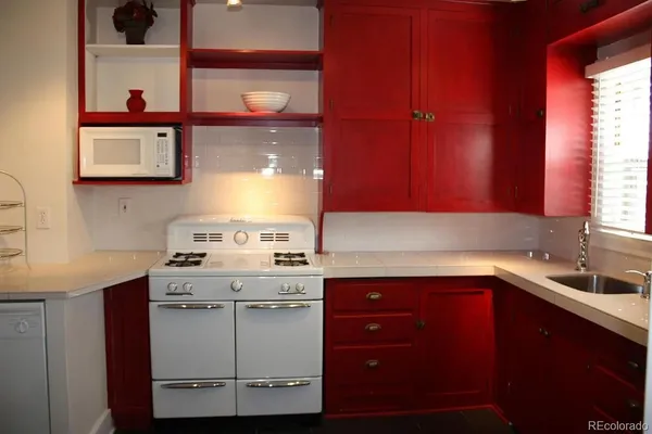 a kitchen with a sink and cabinets