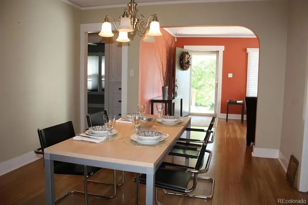 a view of a dining room with furniture window and wooden floor