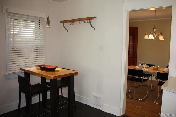 a room with a table and chairs