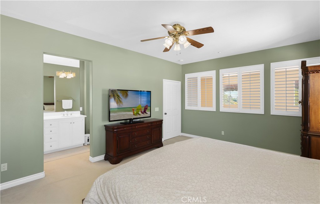 51 Olivehurst Irvine, CA 92602 - Photo 16 of 45 a bedroom with a bed and a chandelier