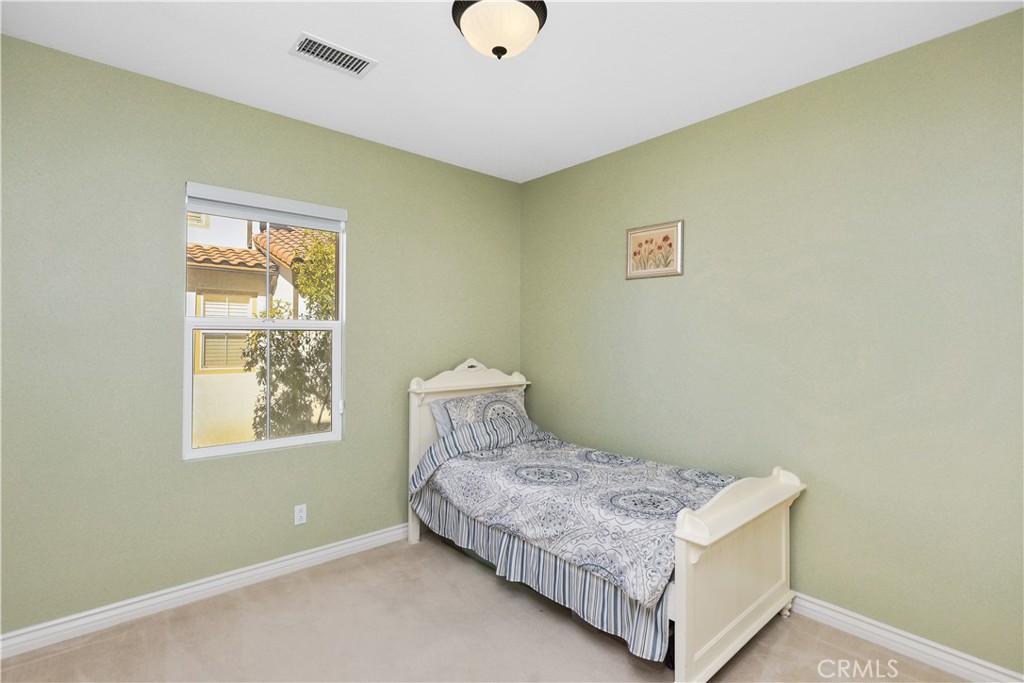 51 Olivehurst Irvine, CA 92602 - Photo 18 of 45 a bedroom with a bed and window
