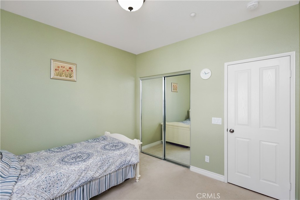 51 Olivehurst Irvine, CA 92602 - Photo 19 of 45 a bedroom with a bed and a table