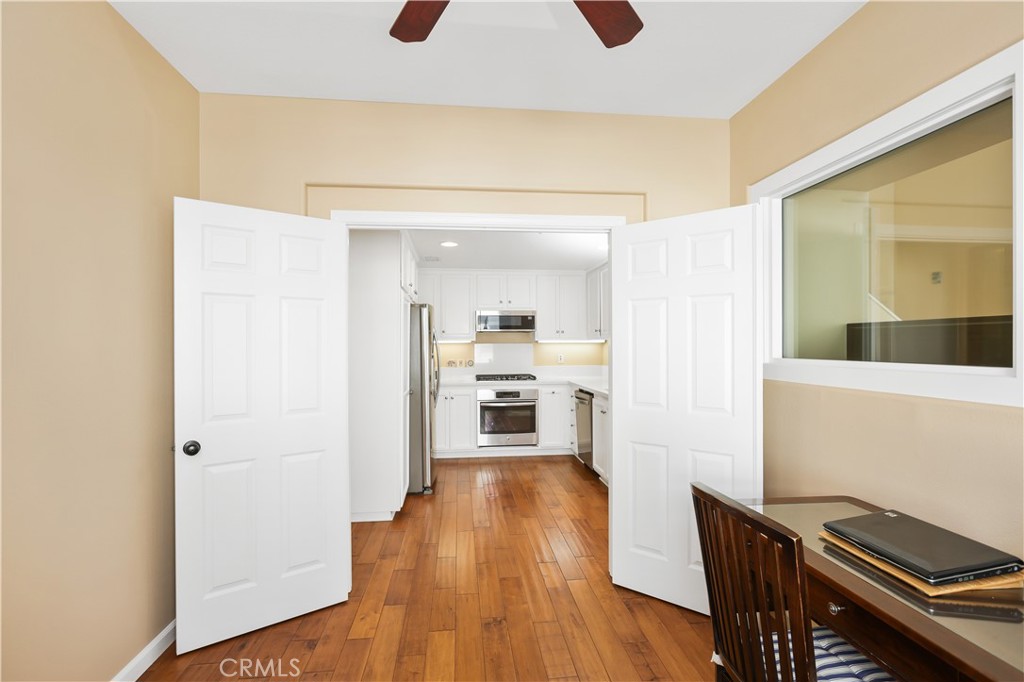 51 Olivehurst Irvine, CA 92602 - Photo 23 of 45 a view of a hallway with wooden floor fireplace and living room
